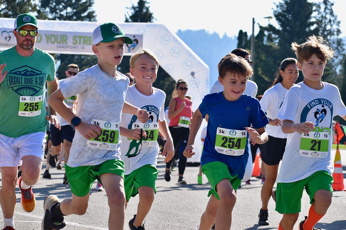 A group of young runners take off from the starting line in the first Find Your Strength 5K/1K Fun Run in 2022.