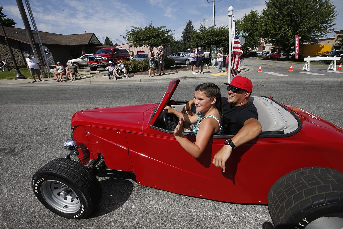 Mark Sanchez is along for the ride as daughter Kynslee Sanchez drives an old race car, customized for her, in the Hayden Days parade.