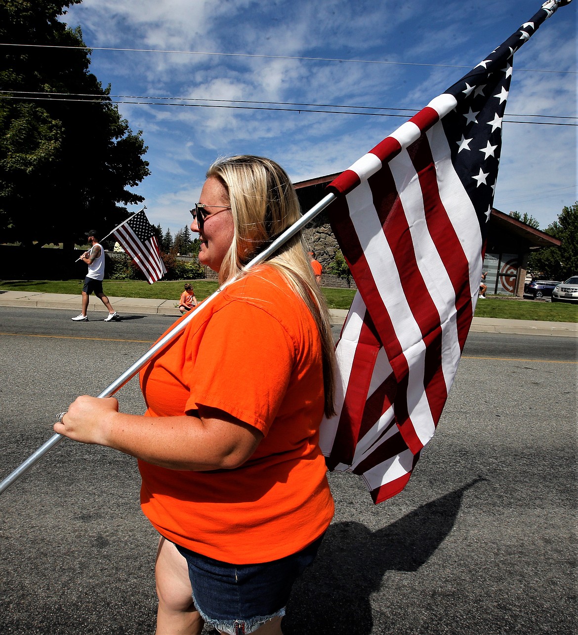 Trisha Robinson carries an American flag during the Hayden Days parade on Saturday.