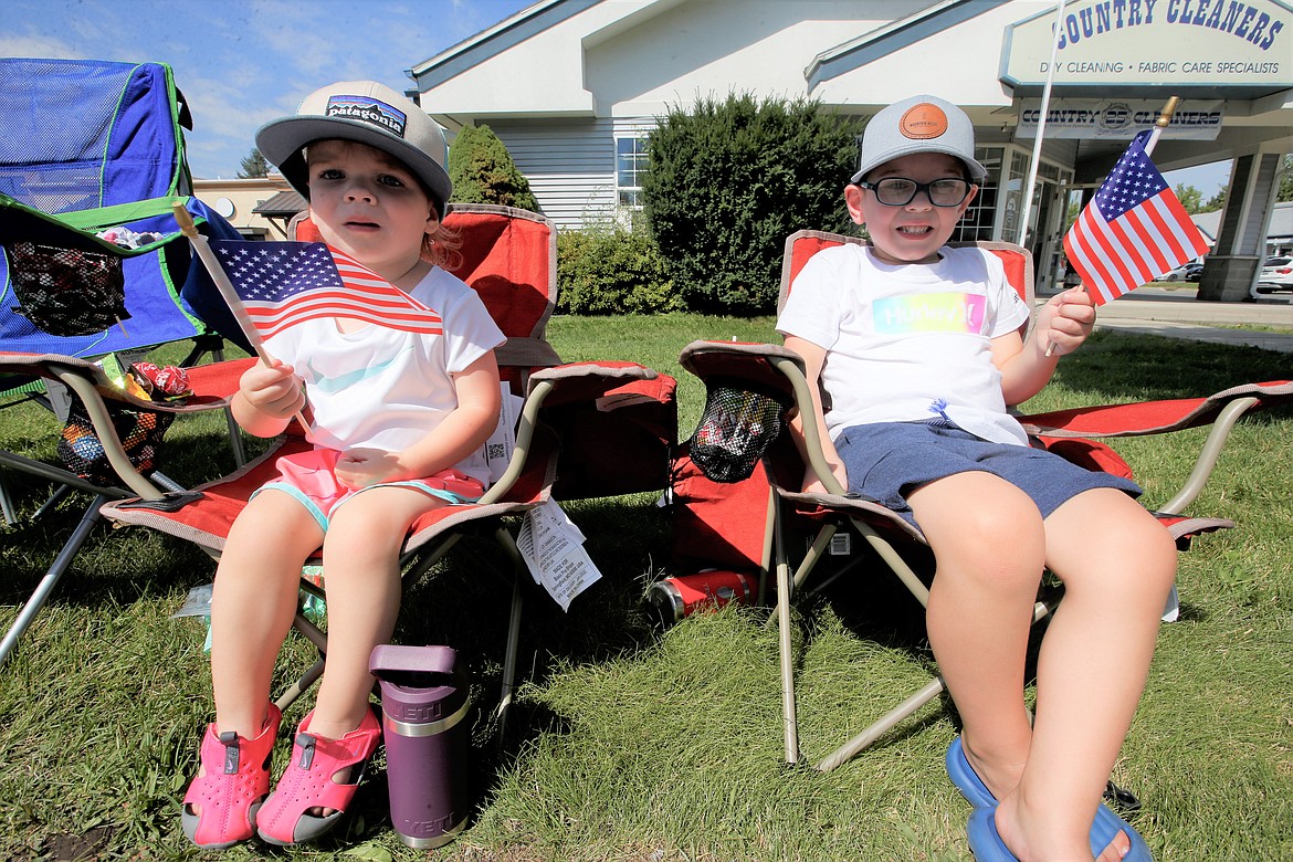 Carter Astin and Emerson Astin watch the Hayden Days parade on Saturday.