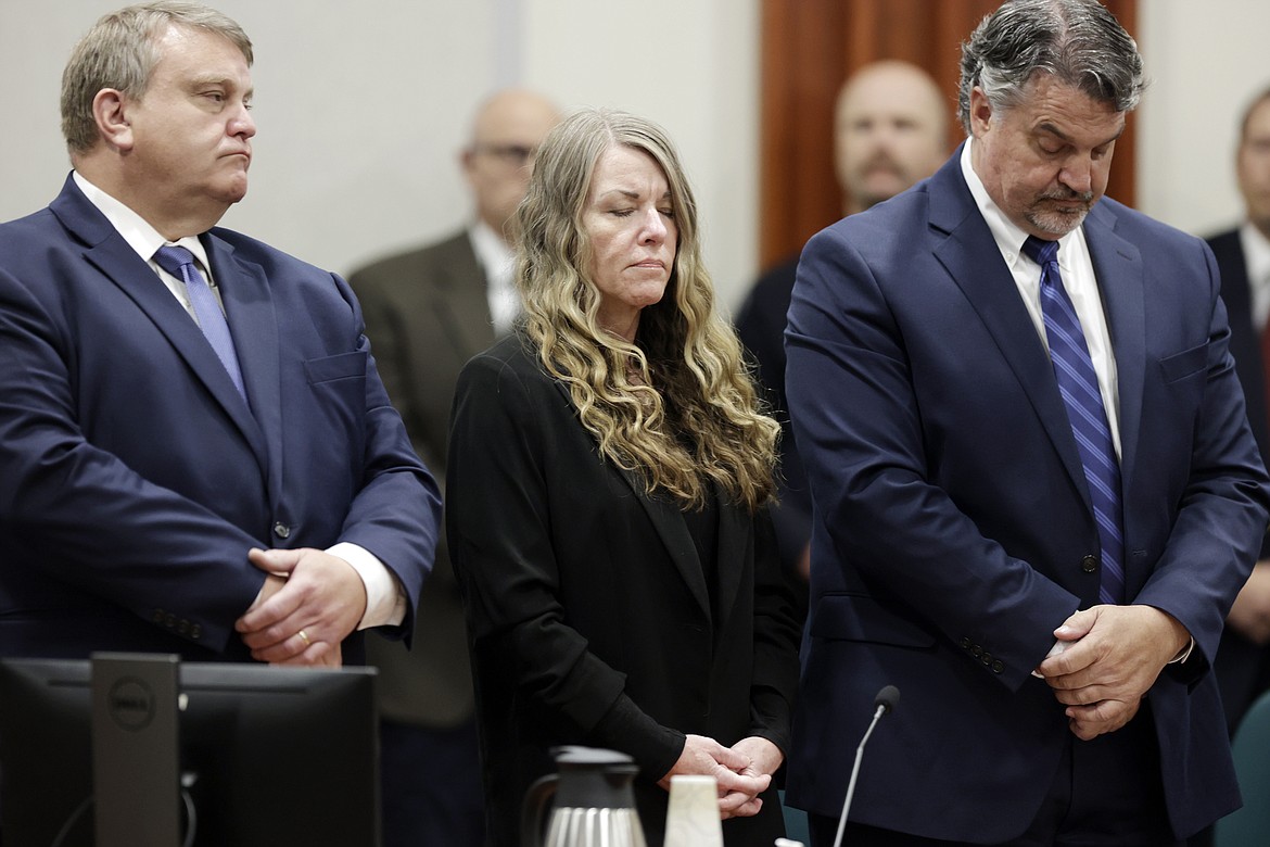 Lori Vallow Daybell stands and listens as the jury's verdict is read at the Ada County Courthouse in Boise, Idaho on Friday, May 12, 2023. Vallow Daybell faces up to life in prison without parole when she is expected to be sentenced Monday, July 31, in the murders of her two youngest children and a romantic rival. (AP Photo/Kyle Green, File)