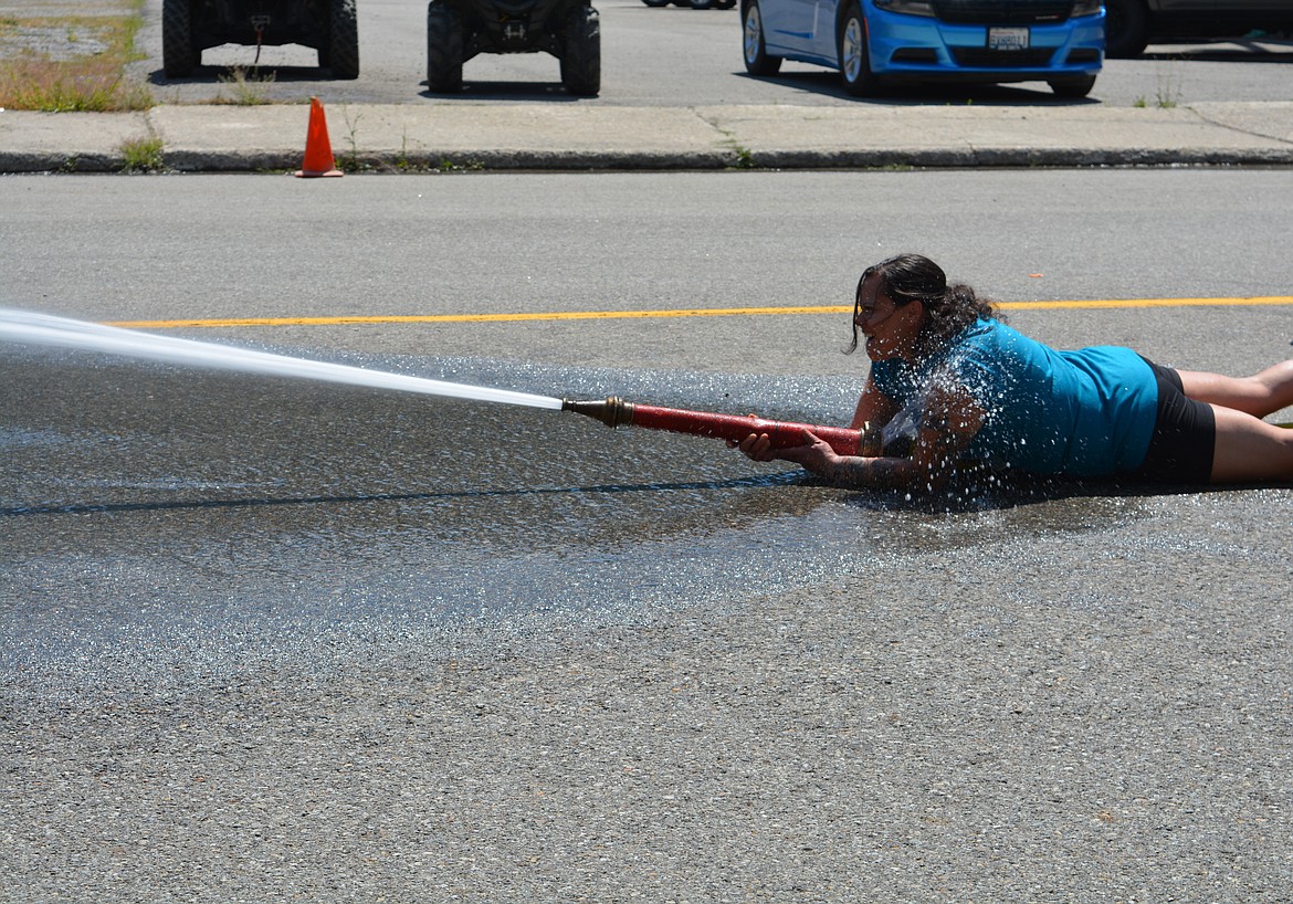 Competitors in the Make-n-Break race to assemble a fire hose, aim and knock over a target with water, and then disassemble a fire hose. The four-person team with the best time wins. The two-day celebration hosts competitions for adults and kids as part of a fundraiser for the Mullan Volunteer Fire Department.