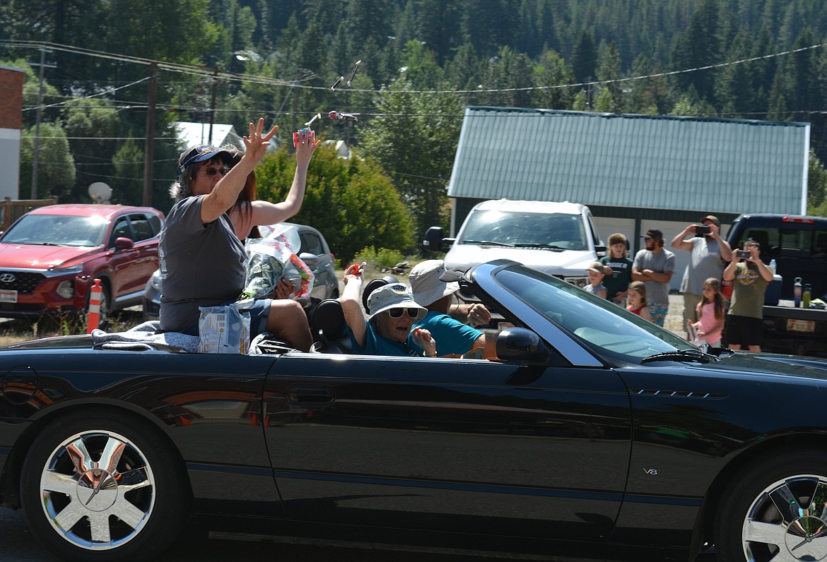 Candy is thrown to spectators during the parade Saturday at Mullan Fireman's Fun Festival. The two-day celebration hosts competitions for adults and kids as part of a fundraiser for the Mullan Volunteer Fire Department.