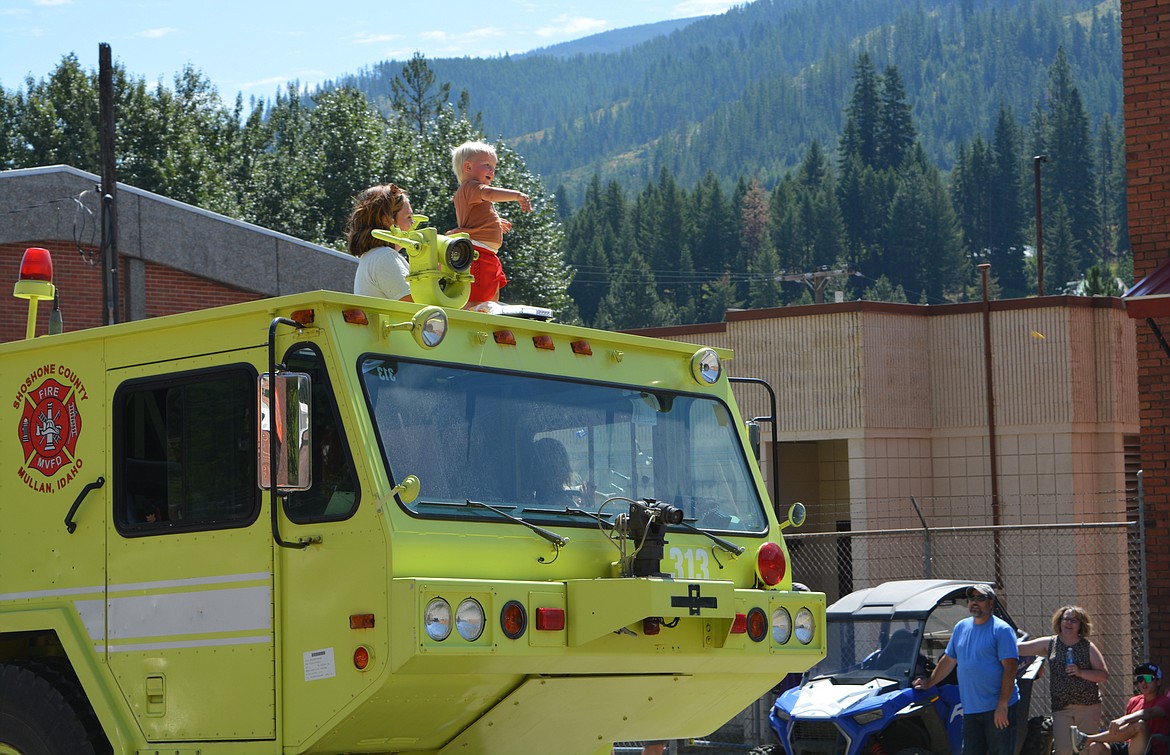 Riggs Rasmussen hurled candy at spectators from the top of a fire truck during the parade at the Mullan Fireman’s Fun Festival Saturday.