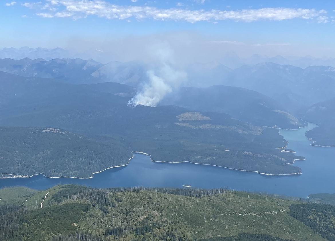 Smoke rises from a wildfire along the Hungry Horse Reservoir. (Flathead National Forest photo)