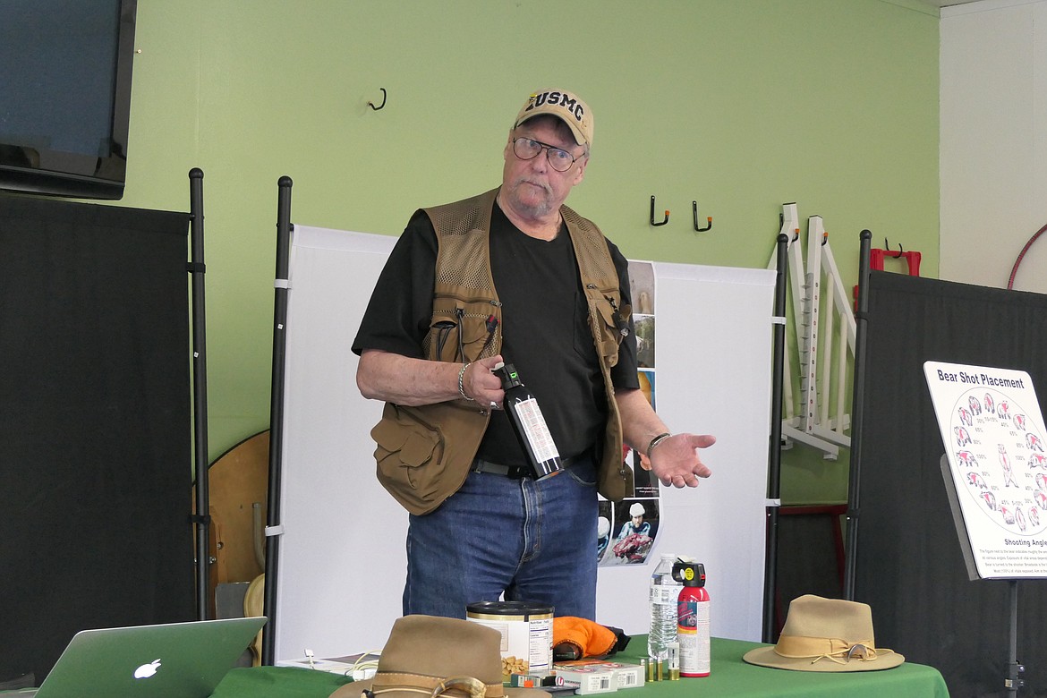 Bear expert Brent Hudson with a can of bear spray with CFC, the most effective kind of bear spray. (Chuck Bandel/VP-MI)