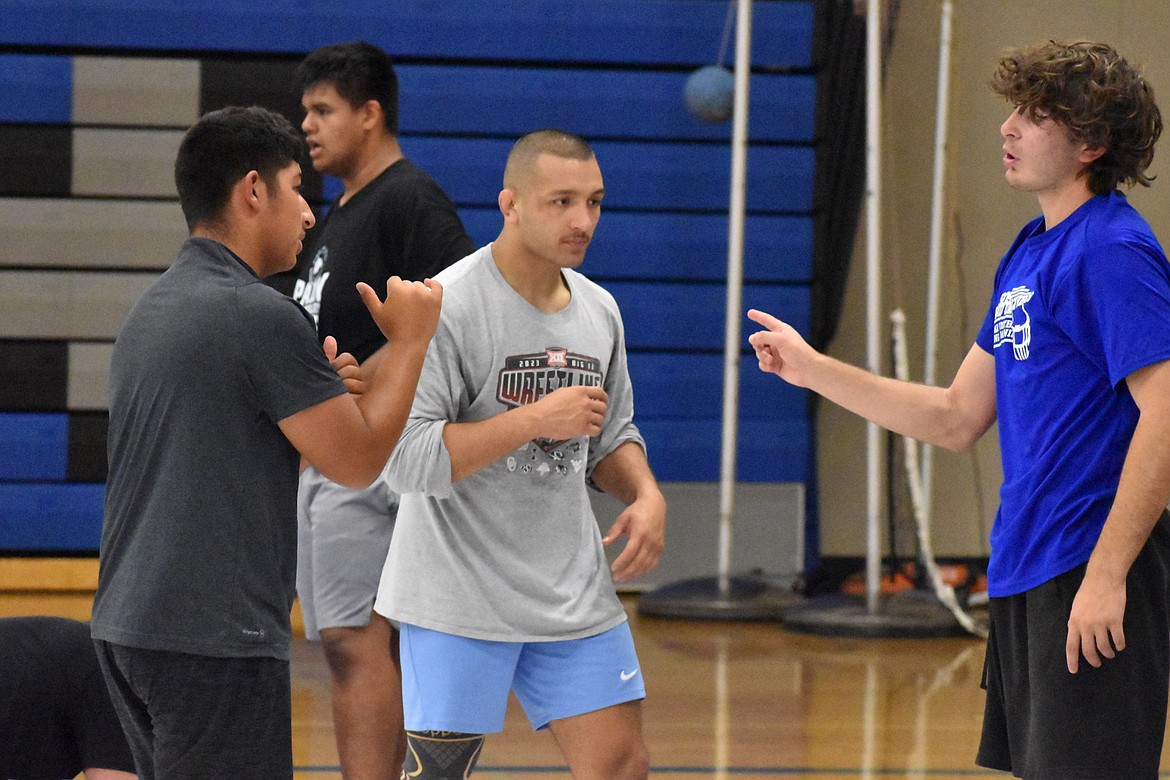 The Chasing Gold Camp, hosted at Moses Lake High School, features instruction from Frank Almaguer, center, on Friday and Saturday. The camp is free for Moses Lake middle and high school wrestlers.