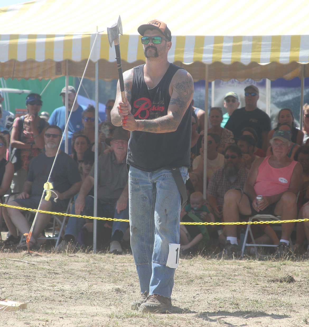 A competitor stares down his target as he gets ready to throw an ax during the Timber Days ax throw, which is part of the logging competitions.