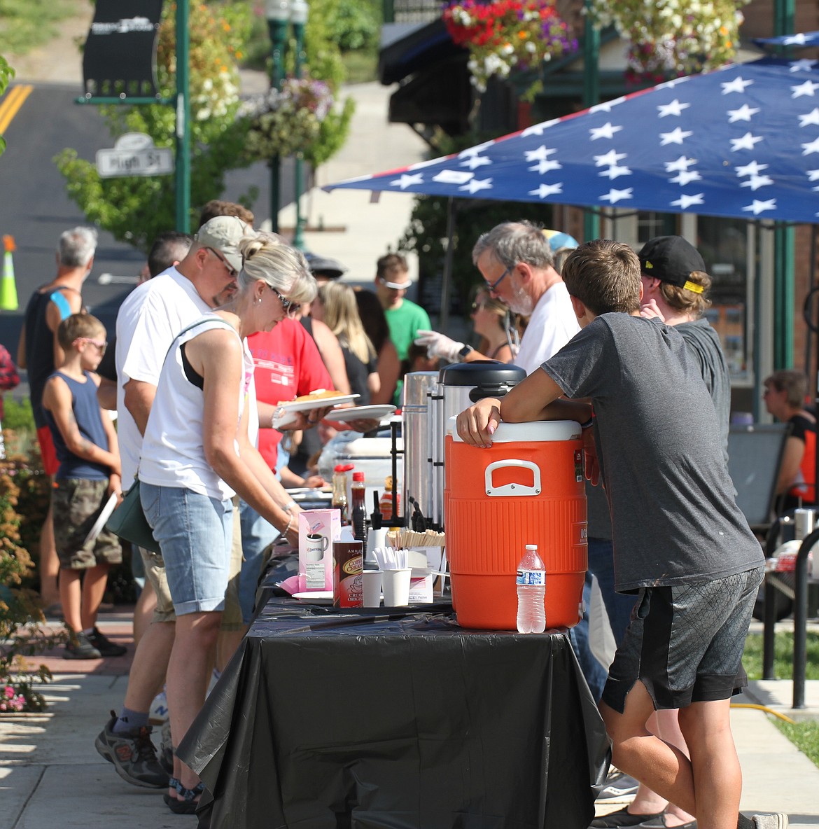 Locals stand in line waiting for their huckleberry pancakes at the PRLHS booster club pancake breakfast on Saturday morning.