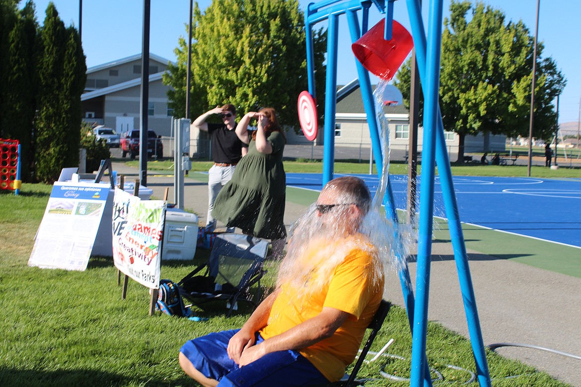 Participants missed the target a few times, but the law of averages caught up with Quincy Parks and Recreation Director Pat Harrington during National Night Out Monday.