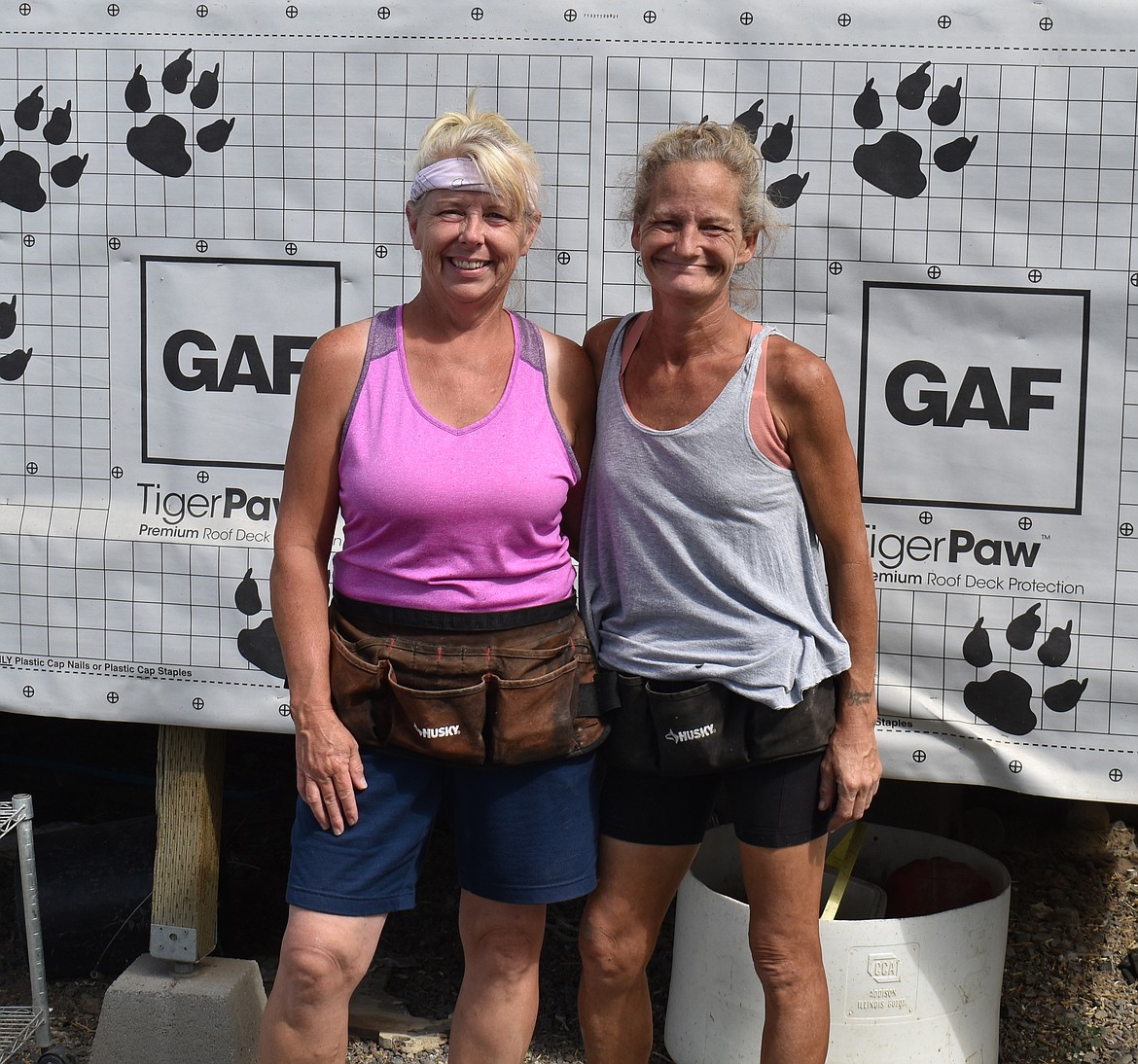 Shawna Kluge, right, and Tina Funk at Rock Bottom Rocker Pet Pantry’s rescue site. The organization has come a long way from the impromptu food bank it began as.