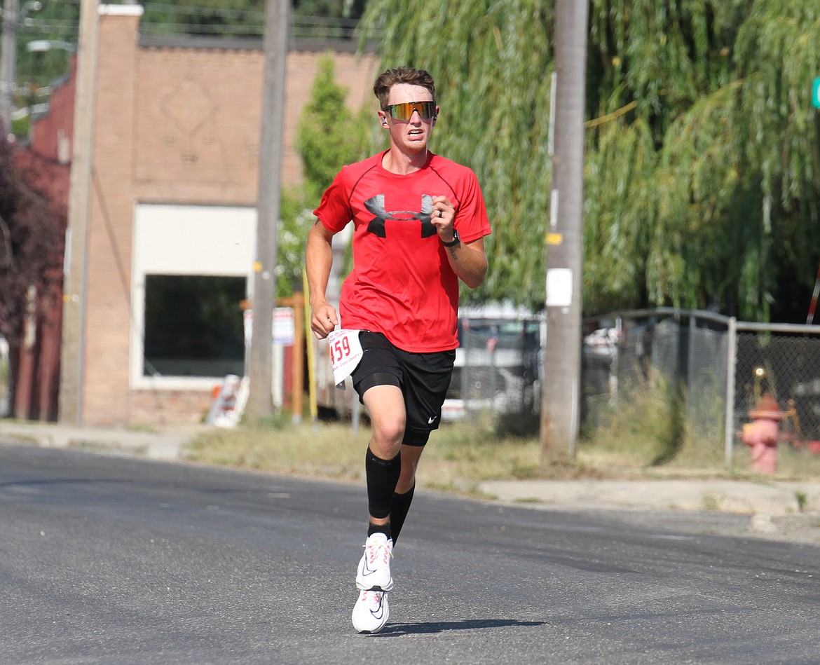 A runner makes his way down Montgomery Street, nearing the Run to the Berries finish line on Saturday morning.