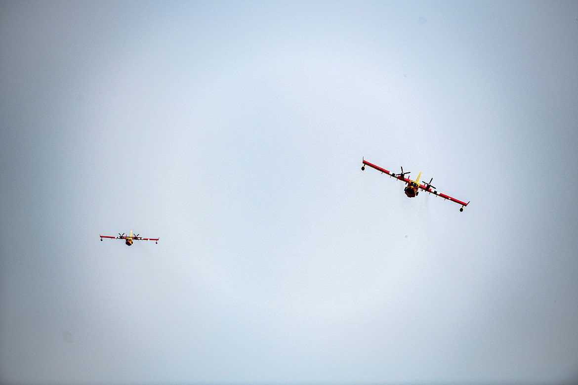 Two Super Scooper aircrafts circle above Flathead Lake near Elmo on Wednesday, Aug. 2. (Casey Kreider/Daily Inter Lake)