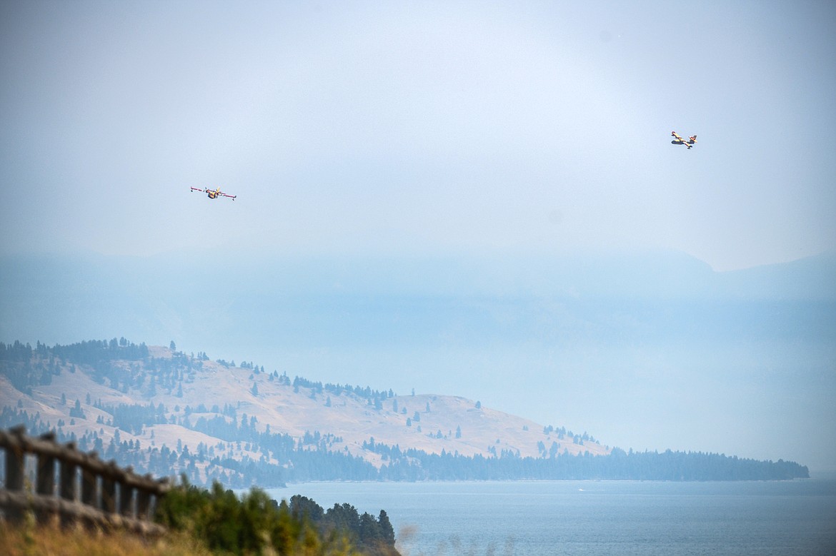 Two Super Scooper aircrafts circle above Flathead Lake near Elmo on Wednesday, Aug. 2. (Casey Kreider/Daily Inter Lake)