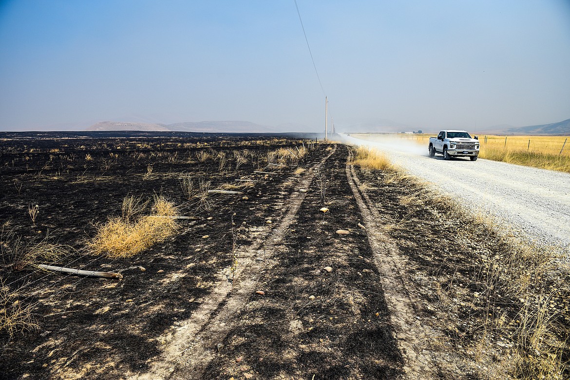 Charred grassland from the Niarada Fire north of Highway 28 on Wednesday, Aug. 2. (Casey Kreider/Daily Inter Lake)