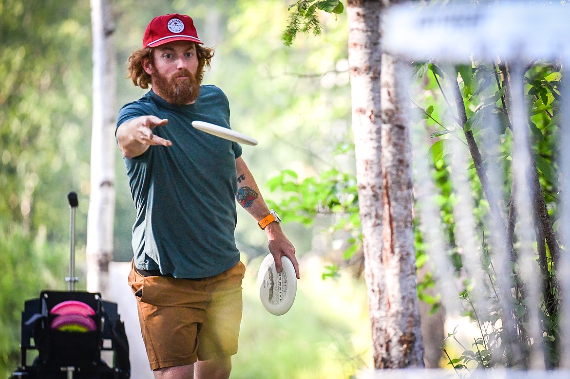 Tabor Martin putts during a Flathead Valley Disc Golf round at Lawrence Park in Kalispell on Tuesday, Aug. 1. (Casey Kreider/Daily Inter Lake)