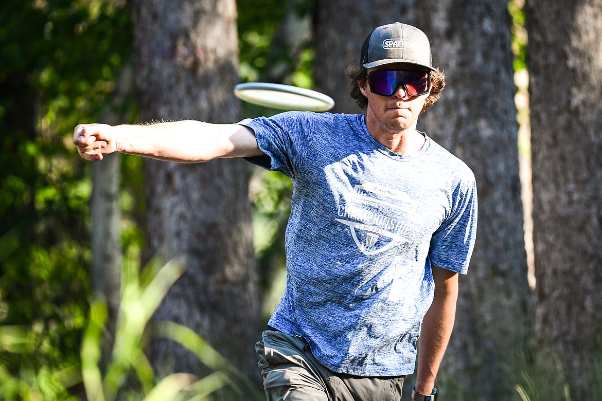 David Trussell, president of Flathead Valley Disc Golf, throws his driver disc during a round at Lawrence Park in Kalispell on Tuesday, Aug. 1. (Casey Kreider/Daily Inter Lake)