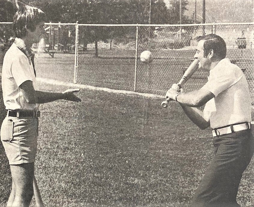 Red Halpern, right, and assistant Steve Anthony stage a photo op to promote the city’s softball tournaments.