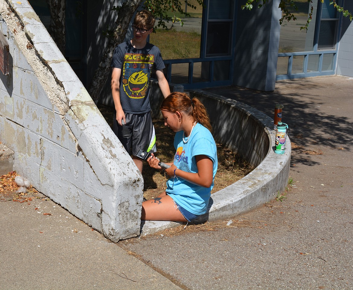 Teens work on scraping exterior walls at Kellogg Middle Shcool.

Idaho Servant Adventures has taken on the task of repainting the school. The program is attached to Lutherhaven Ministries and based out of Shoshone Mountain Retreat up the Coeur d’Alene River.