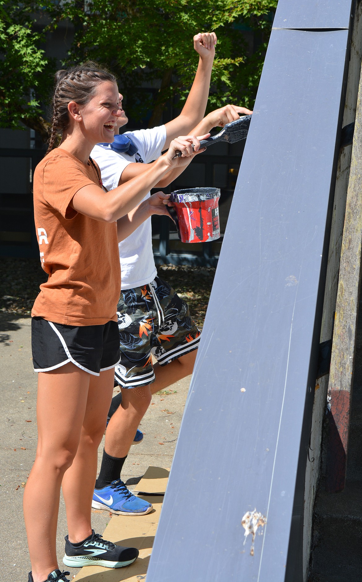 Deborah Toenjes, 22, laughs as she paints alongside Eoghan Addams, 17, at Kellogg Middle School.

Idaho Servant Adventures has taken on the task of repainting the interior and exterior of the school. The program is attached to Lutherhaven Ministries and based out of Shoshone Mountain Retreat up the Coeur d’Alene River.