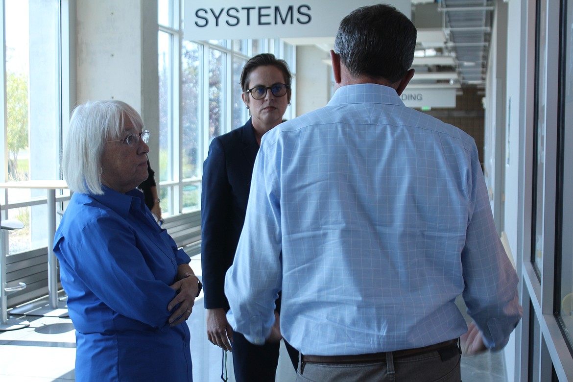 Senator Patty Murray, left, discusses workforce development with Big Bend Community College President Sara Thompson Tweedy, center and Group14 CEO Rick Luebbe, back to camera.