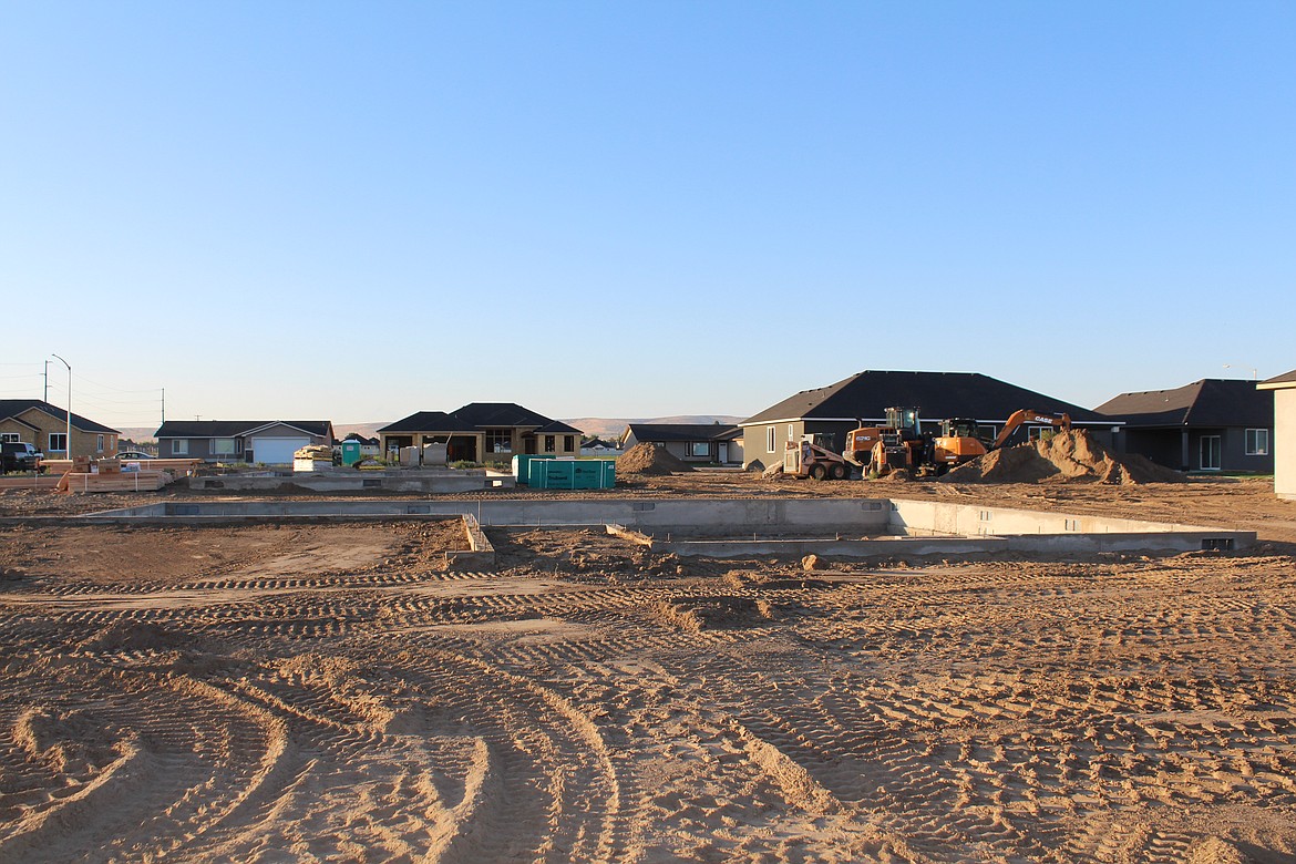 There is some construction activity in Quincy; building materials are assembled next to a foundation in the Palos Verdes development which is currently under construction.