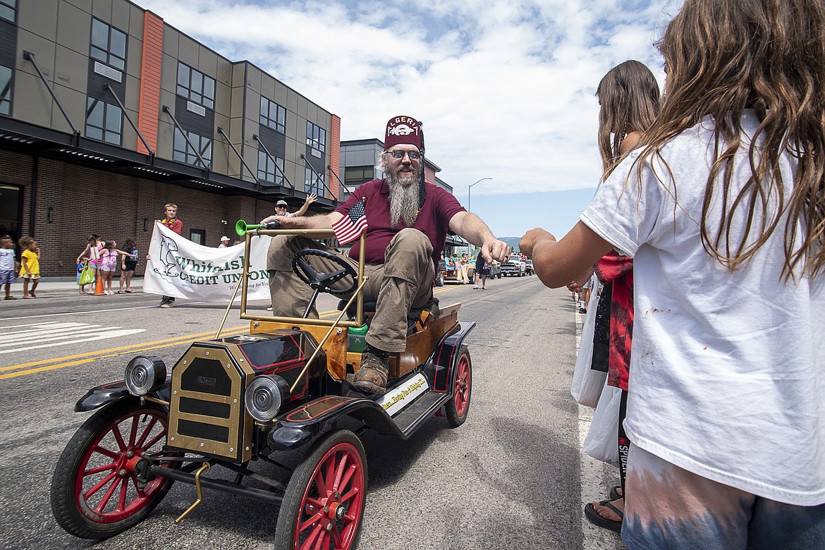 Shriners hand out candy to parade-goers during Saturday's parade.