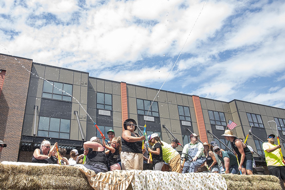 With temperatures in the 90s, many floats hosed down the crowd with water squirters.