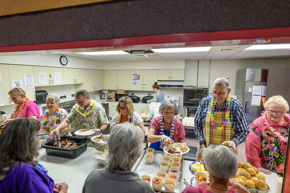 A host of volunteers serve the meals.