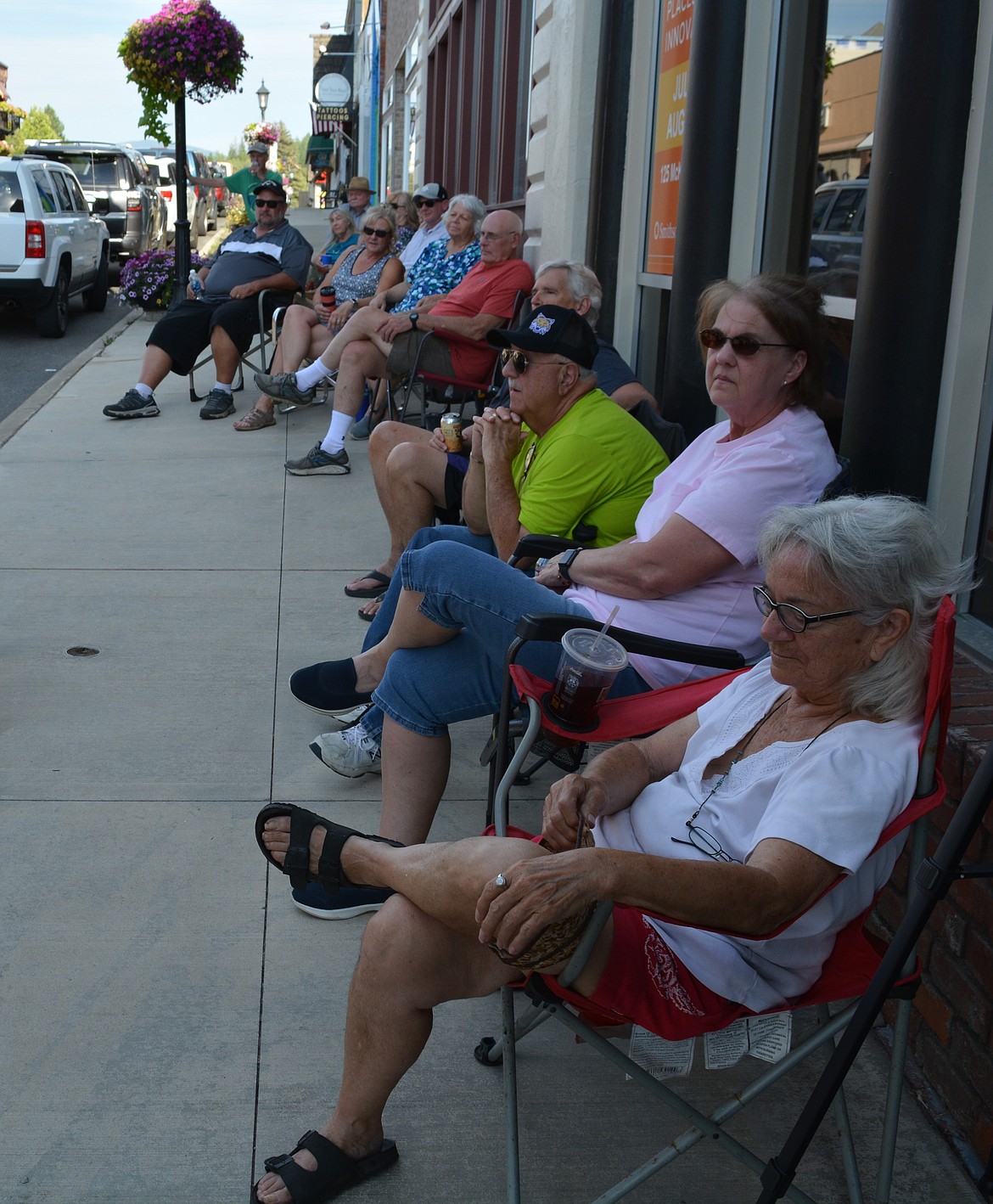 Spectators watch as Duane “Duke” Little talked about the connection that his family had to the Mining Wars in 1899 during a Front Porch Conversations in front of 125 McKinley Ave. in Kellogg.