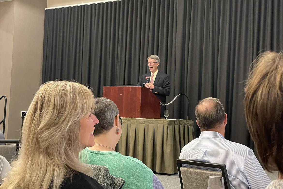 Dr. Pat Barkey addresses an audience of business representatives at the Midyear Economic Update Tour, organized by the Bureau of Business and Economic Research in Kalispell. (Adrian Knowler/Daily Inter Lake)