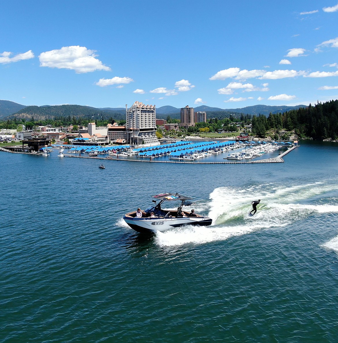 A boat cruises on Lake Coeur d'Alene in front of The Coeur d'Alene Resort. The Idaho Travel Council has announced it has awarded $10.3 million for tourism promotion across Idaho. Nearly $2 million of that money has been granted to organizations in North Idaho.