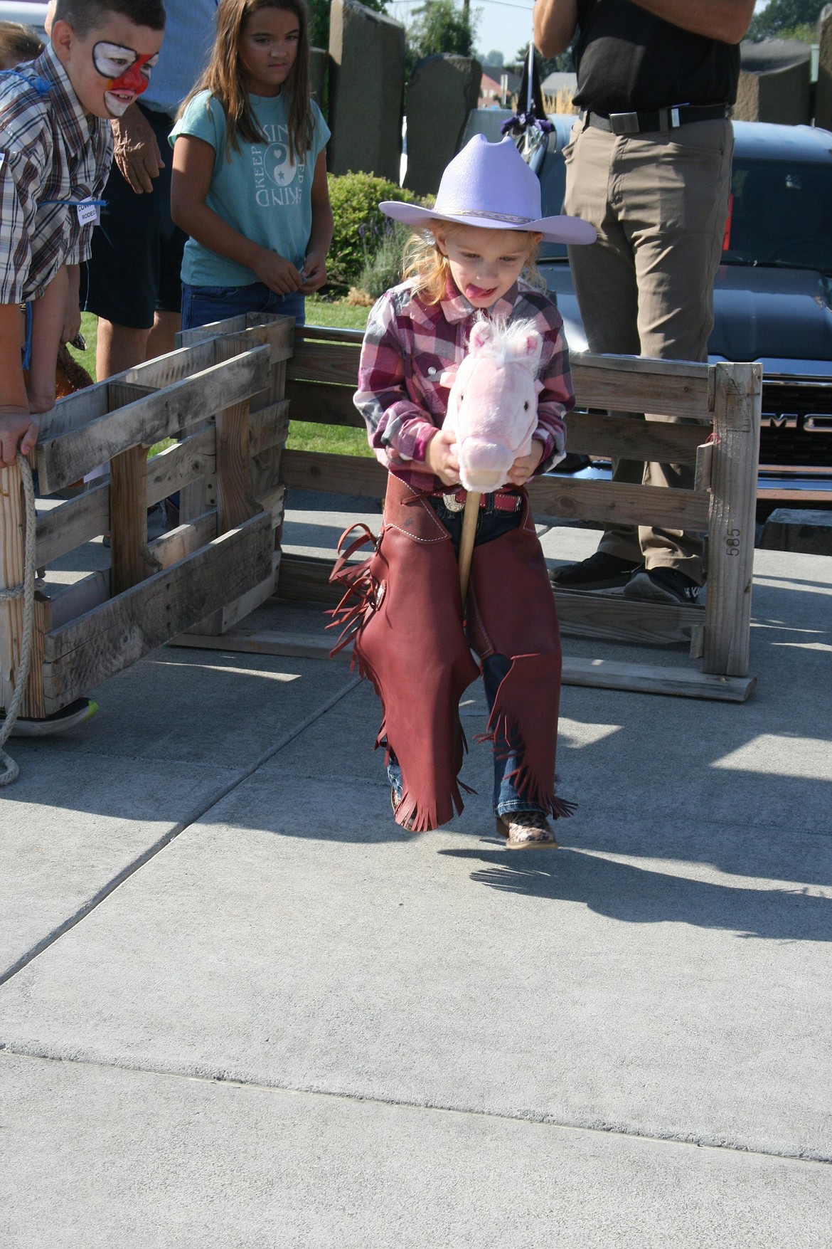 Harper Carey and her bucking bronc charge out of the gate at the 2022 Cowboy Breakfast. The traditional kickoff for the Grant County Fair and Moses Lake Roundup, breakfast is served Friday morning.