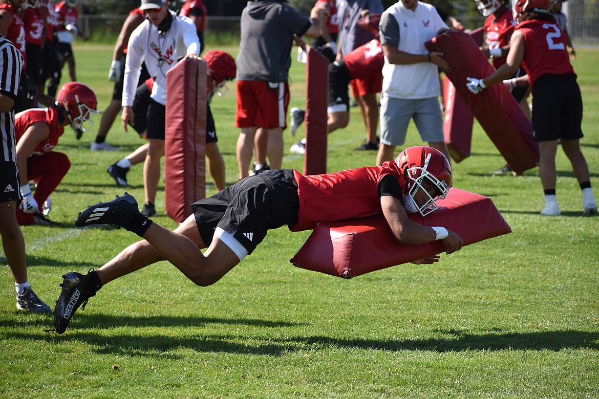 Eastern Washington cornerback Zion Jones dives during a tackling drill during Thursday’s first practice of fall camp.