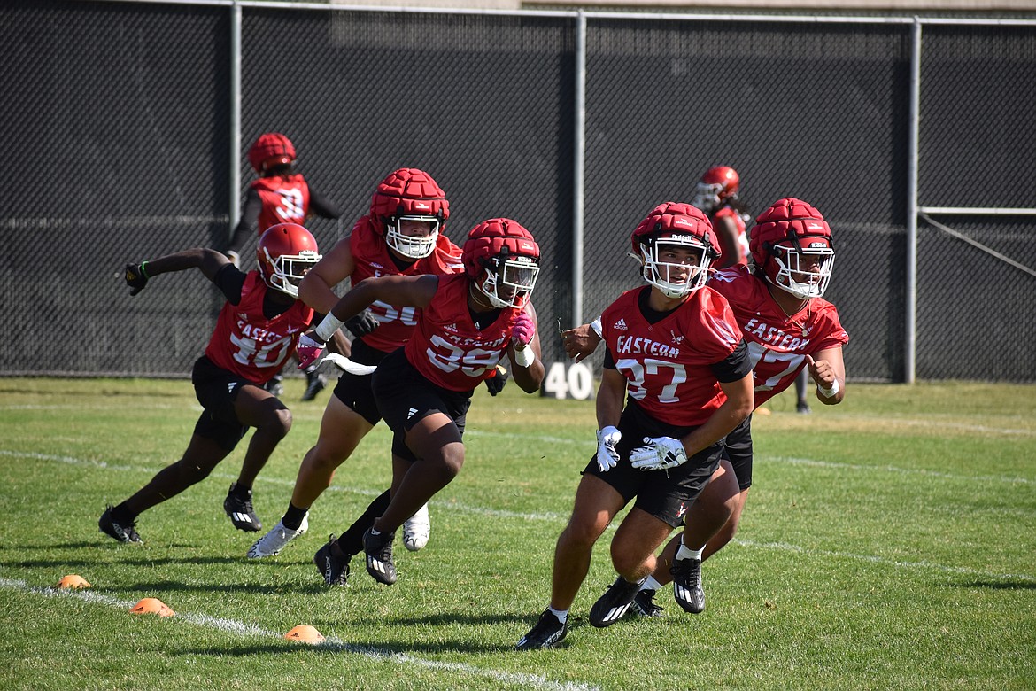 Eastern Washington defenders turn during a pursuit drill at Thursday’s practice in Cheney.