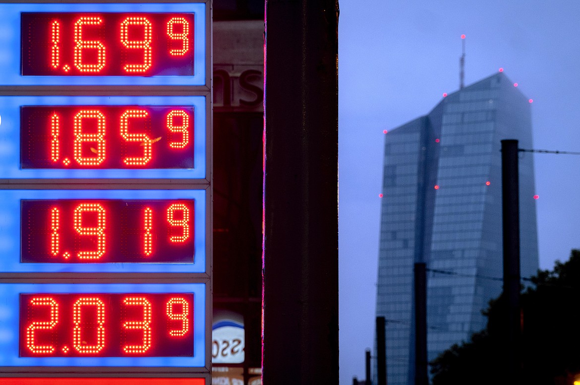 FILE - Gas prices are displayed at a gas station in Frankfurt, Germany, on July 28, 2023. The European economy grew modestly in the most recent quarter, breaking out of a months of stagnation or contraction as higher interest rates designed to fight inflation make it more expensive for households and businesses to borrow, invest and spend. (AP Photo/Michael Probst, File)