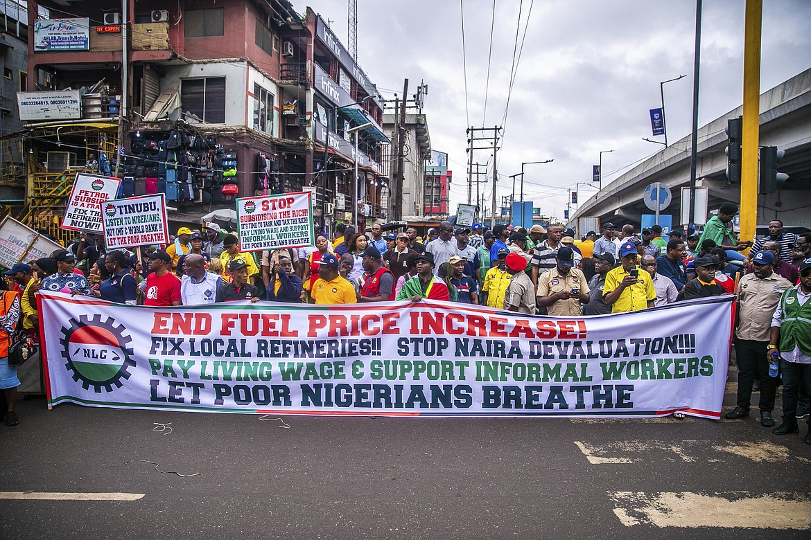 Labour unionists march in the streets of Lagos, Nigeria, Wednesday, Aug. 2, 2023, to protest the soaring cost of living under the West African nation's new president, with calls for the government to improve social welfare interventions to reduce hardship.(AP Photo/ Marcus Ayo)