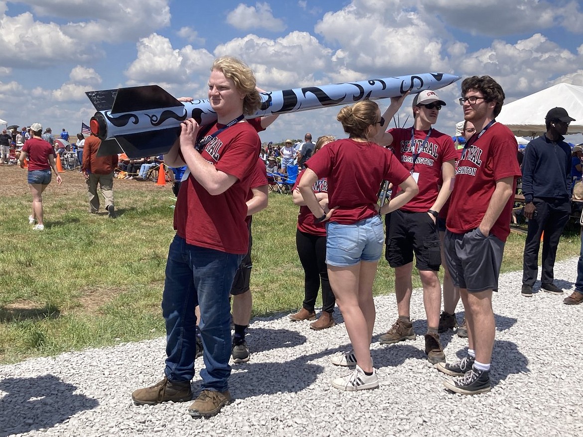 With a rocket taller than they are, members of Wildcat Rocketry competed at national competition this year.