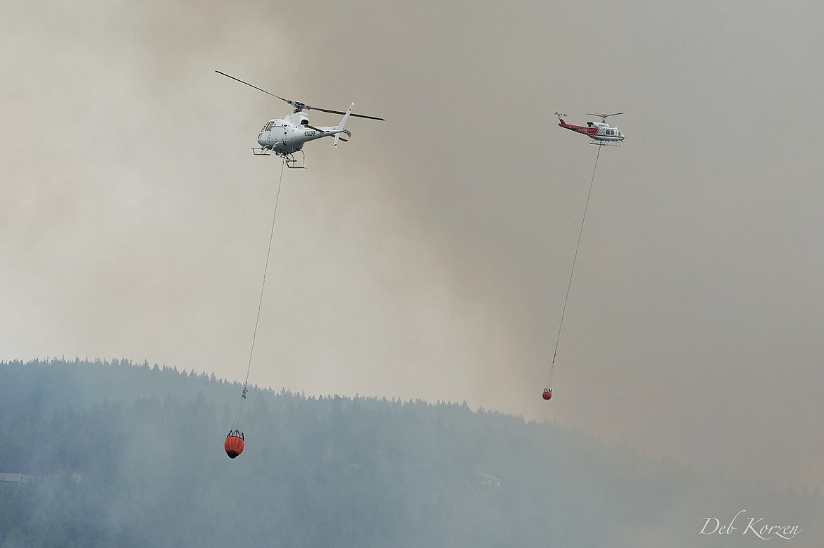 Aerial firefighters attack the Parkway Fire near Q'emiln Park in Post Falls.