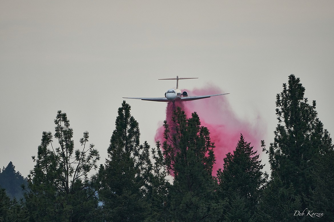 An air tanker drops retardant on the Parkway Fire burning near Q'emiln Park in Post Falls.