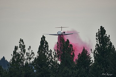 An air tanker drops retardant on the Parkway Fire burning near Q'emiln Park in Post Falls.