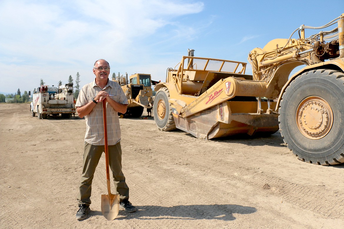 Ponderay Mayor Steve Geiger stands by the large, earth-moving equipment waiting to get to work on the Field of Dreams as the city kick off the project's first phase with a groundbreaking ceremony.