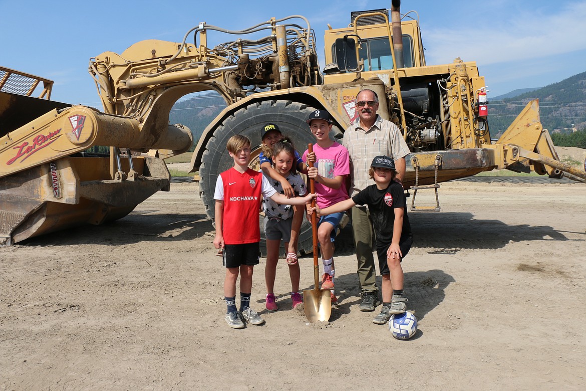 Area youth stand with Ponderay Mayor Steve Geiger before helping him at Friday's groundbreaking ceremony for the Field of Dreams recreation complex.