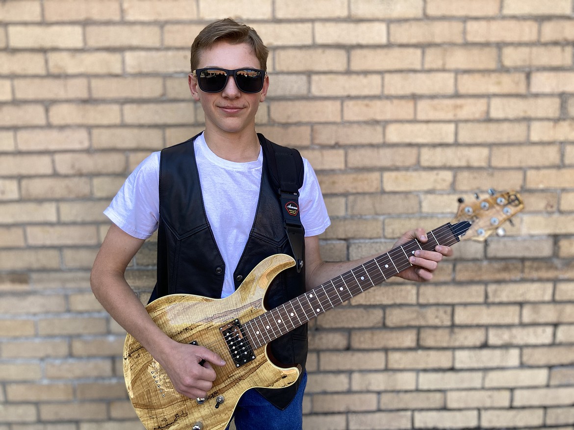 Porter Combs plays guitar and sings, which he plans to do professionally someday.