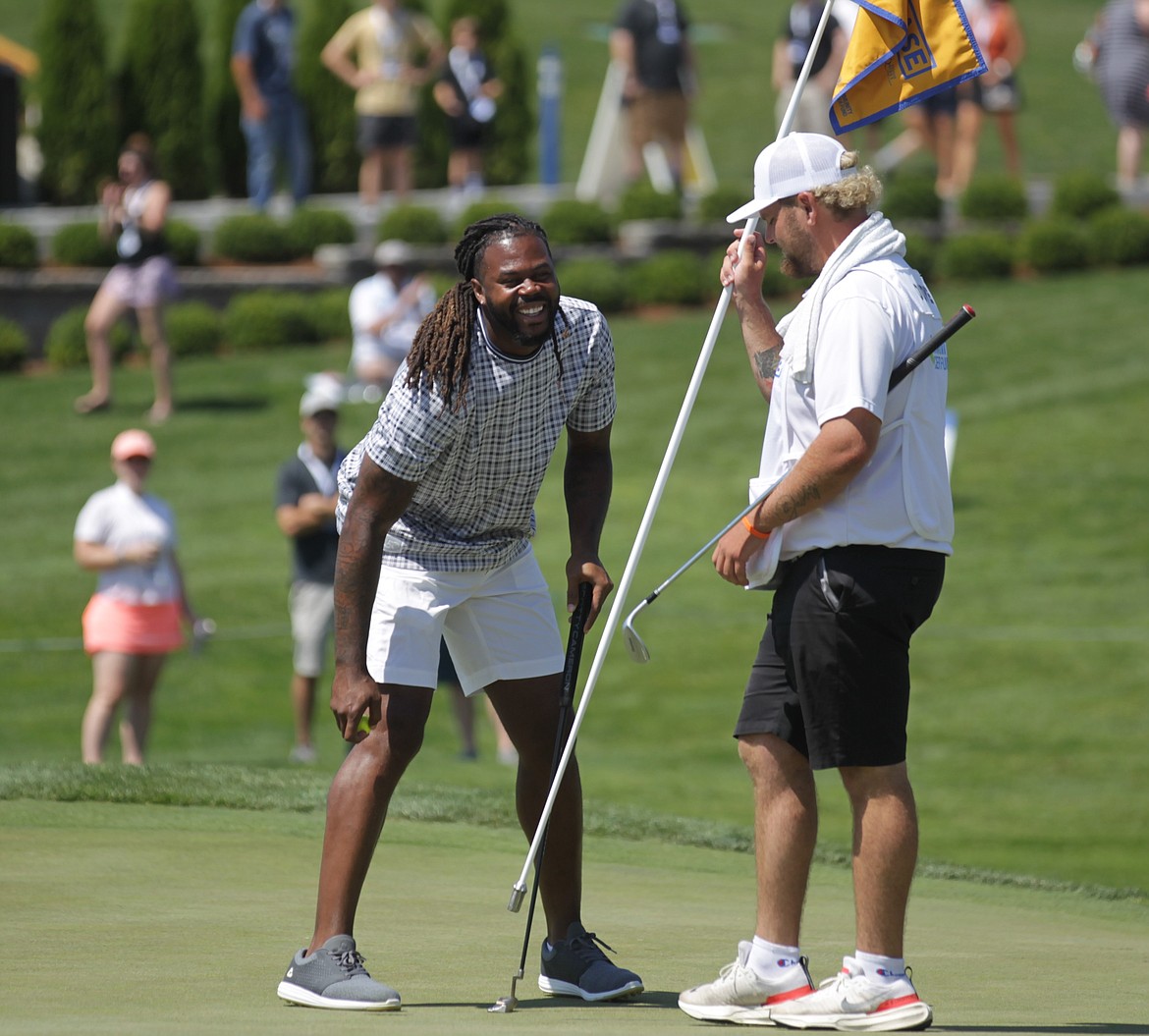 JASON ELLIOTT/Press
Former Seattle Seahawks wide receiver Sidney Rice celebrates after finishing his final round at The Showcase golf exhibition on July 29 at The Coeur d'Alene Resort Golf Course.