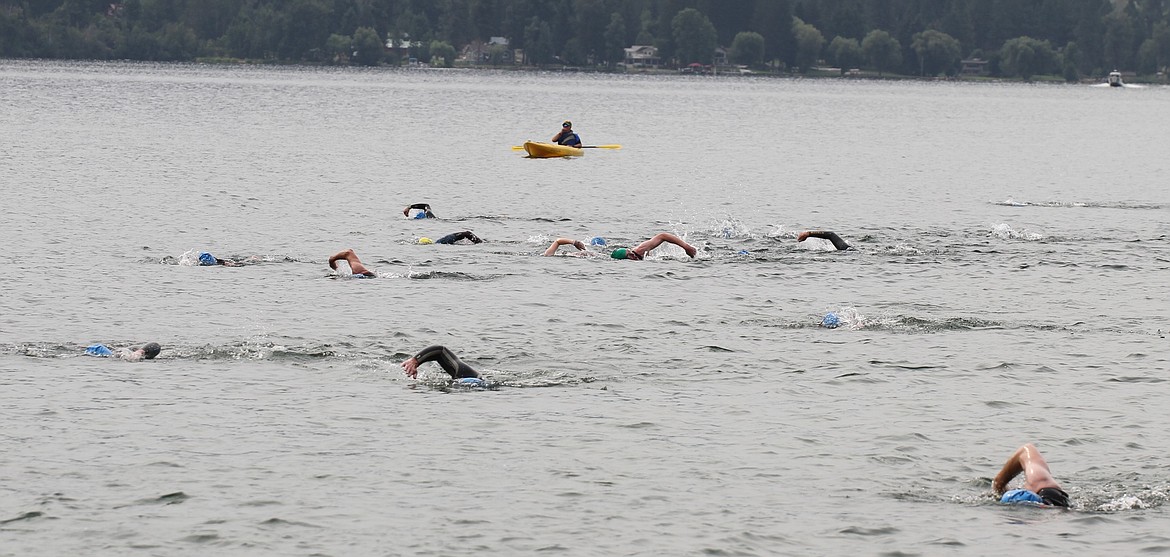 A large group of swimmers near the finish line on Saturday.