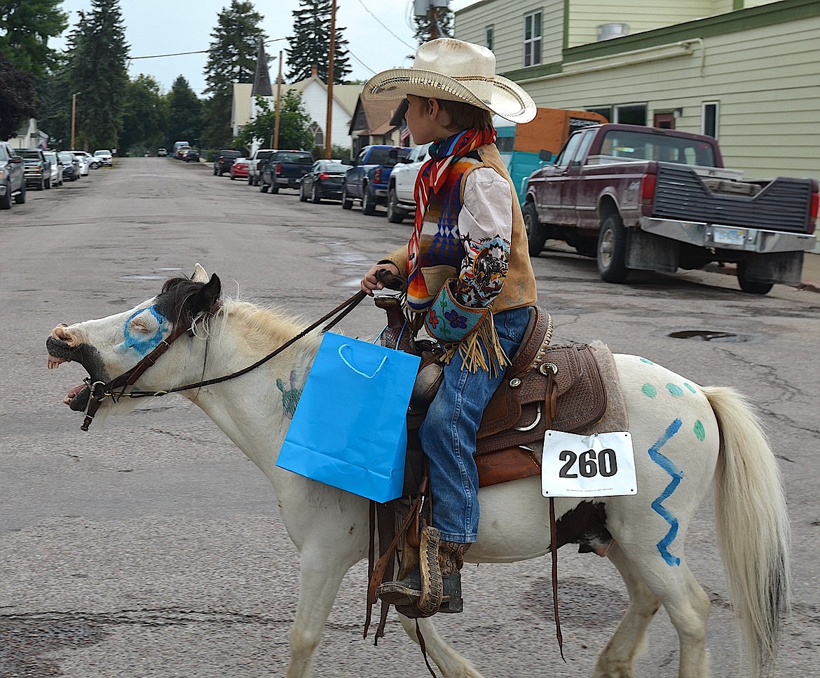 Pony yawns while his rider stays the course down Main Street in Sunday's Pioneer Days parade. (Kristi Niemeyer/Leader)