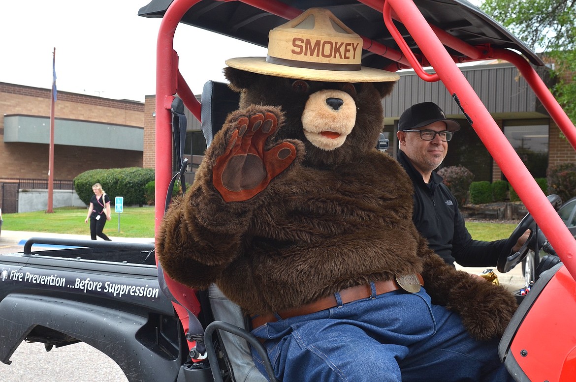 Smokey Bear took a breather from recent wildfire activity to remind parade-goers that fire prevention is better than suppression. (Kristi Niemeyer/Leader)