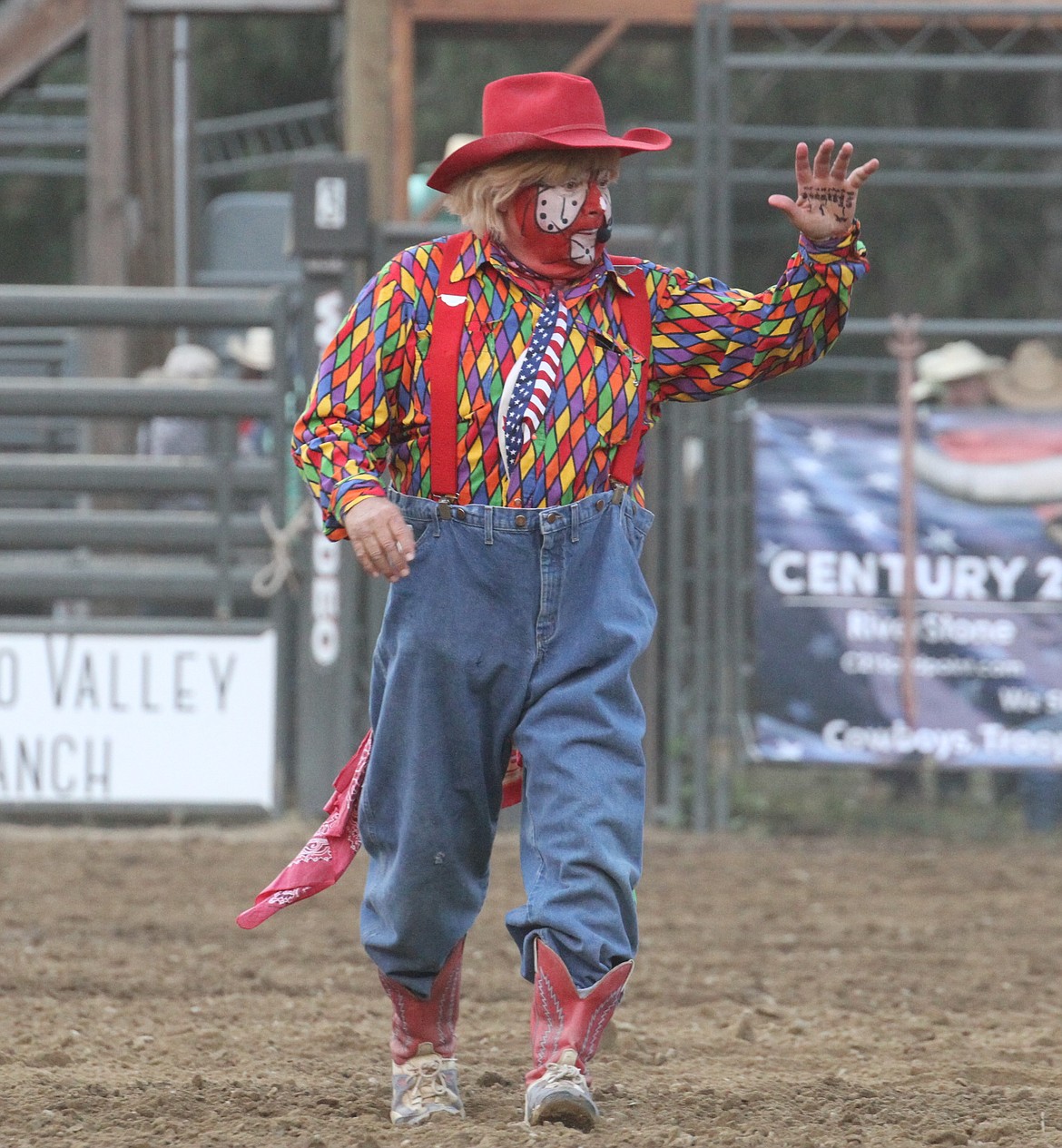 Bert Davis, world renowned rodeo clown, waves to the audience on Friday.