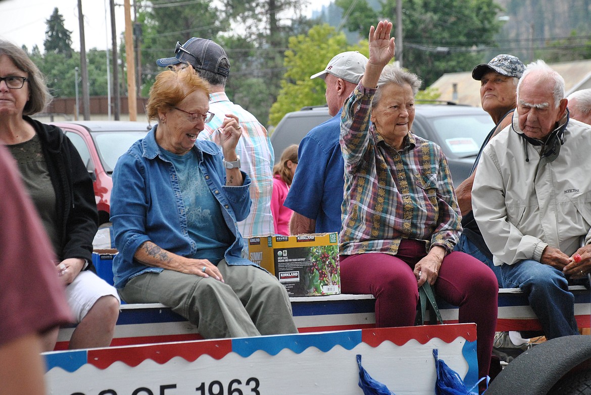 Terry Meeks, a Superior graduate waves from the class of 1963 rides along with her former classmates on their parade float last Saturday. (Mineral Independent/Amy Quinlivan)